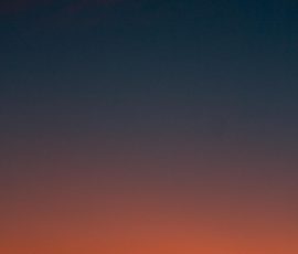 Fiery sunset with crescent moon Crescent moon and fiery orange sunset horizon
